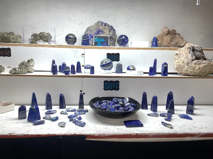 Assorted polished lapis lazuli towers, spheres and stones in deep blue