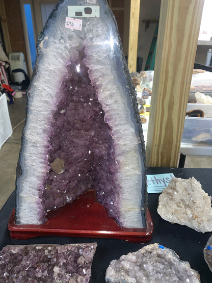 Amethyst cathedral geode showing natural outer matrix and crystal interior