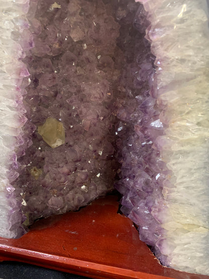 Close-up of secondary crystal formation growing among purple amethyst crystals
