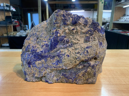 Close-up of blue lapis lazuli mineralization within natural host rock