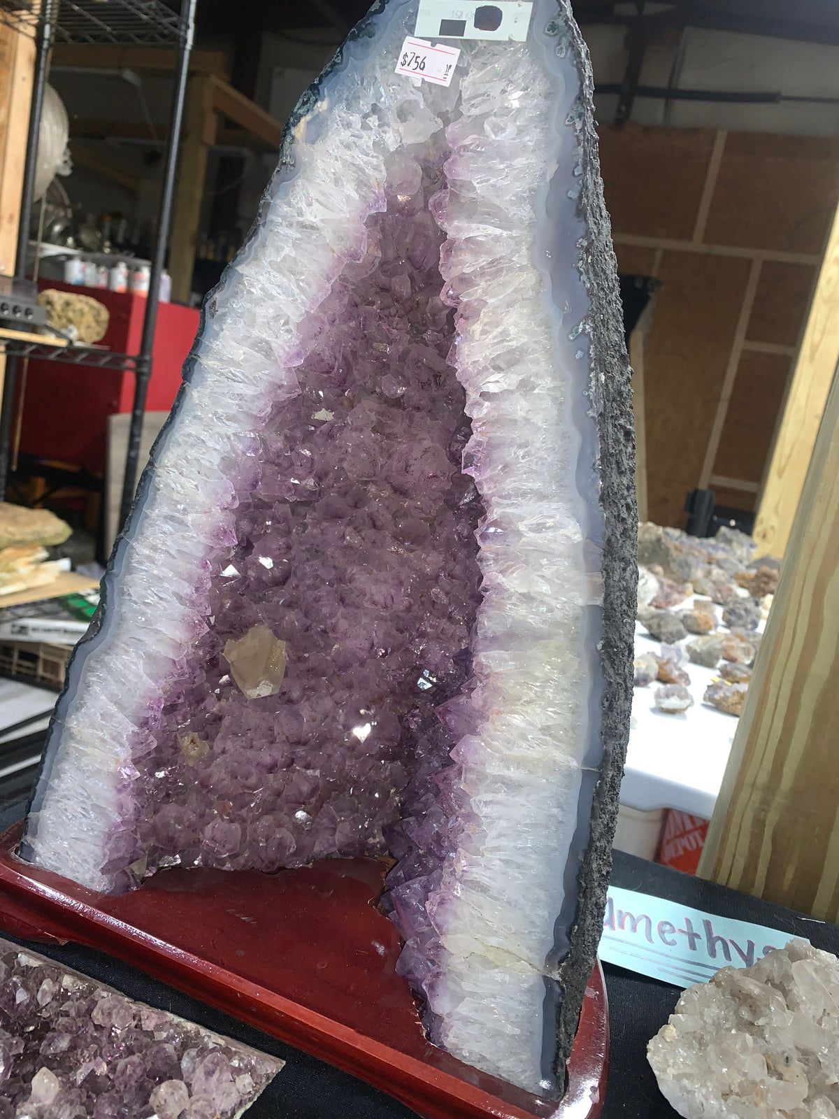 Angled view of amethyst cathedral showing purple quartz and pale crystal growth
