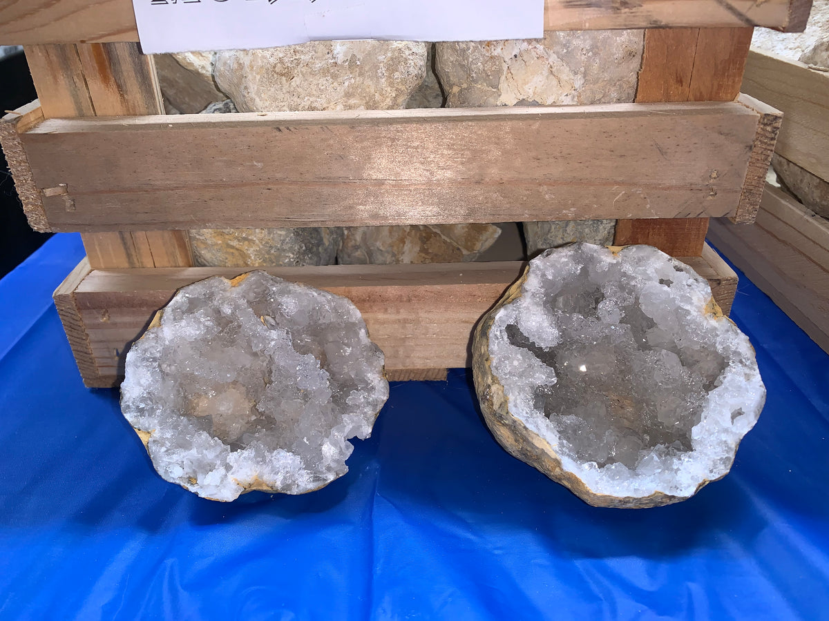 Opened Moroccan quartz geodes showing sparkling white crystal interiors