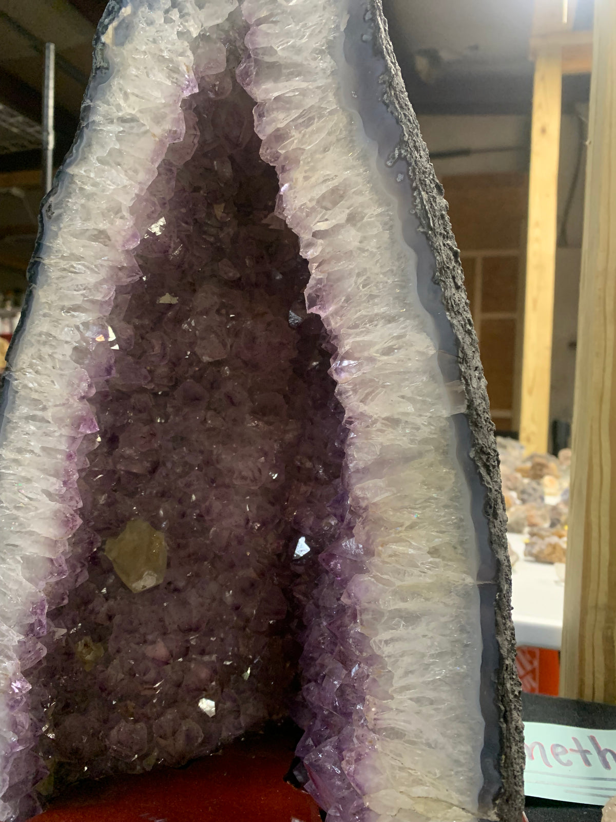 Close-up of amethyst crystal points inside cathedral geode