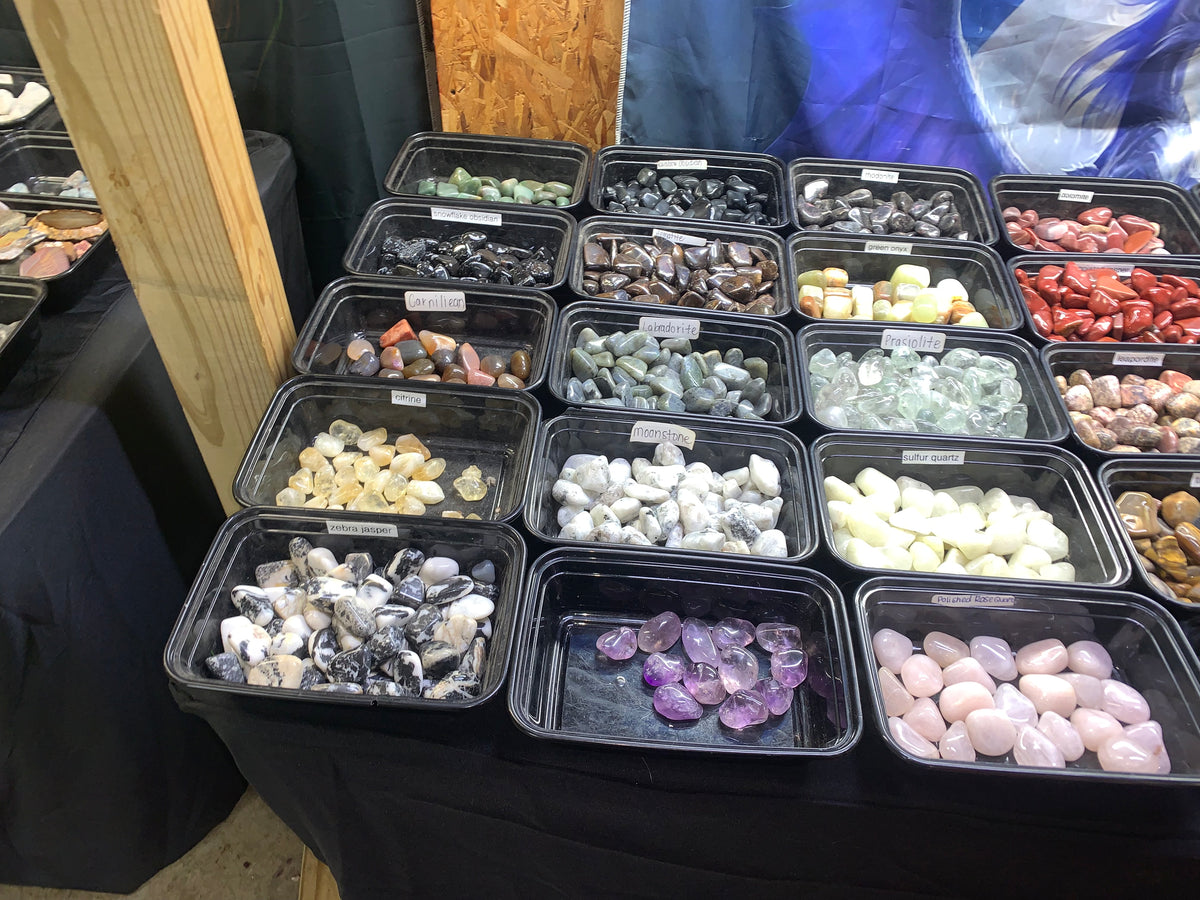Selection of colorful polished gemstones and tumbled stones available at Earthforged Rock Shop.