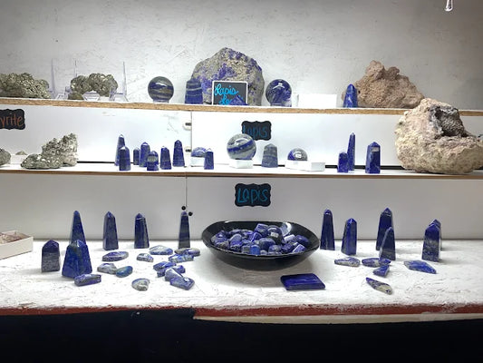 Assorted polished lapis lazuli towers, spheres and stones in deep blue