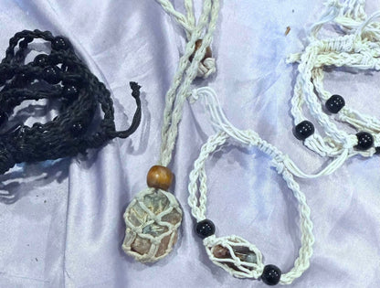 Black and natural macramé stone holder necklaces and bracelets shown with crystals and tumbled stones
