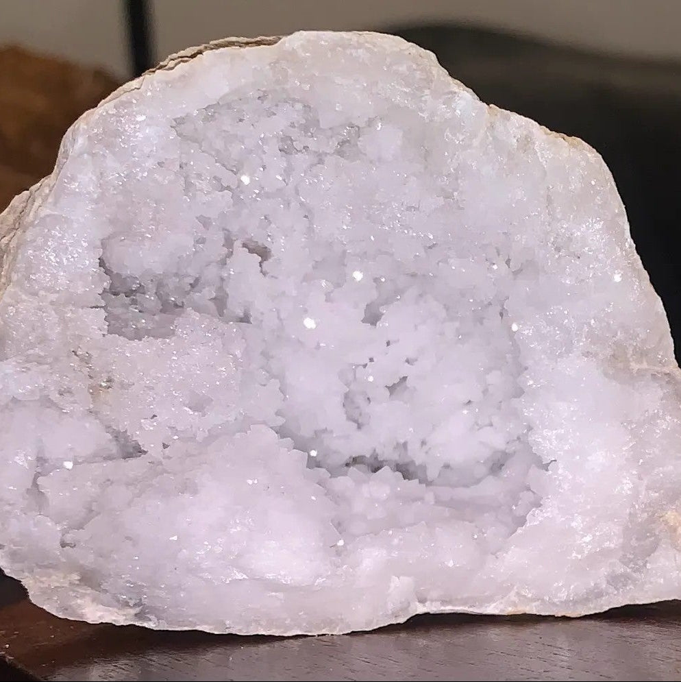 Close-up of an opened Moroccan quartz geode with white snowy quartz crystal interior