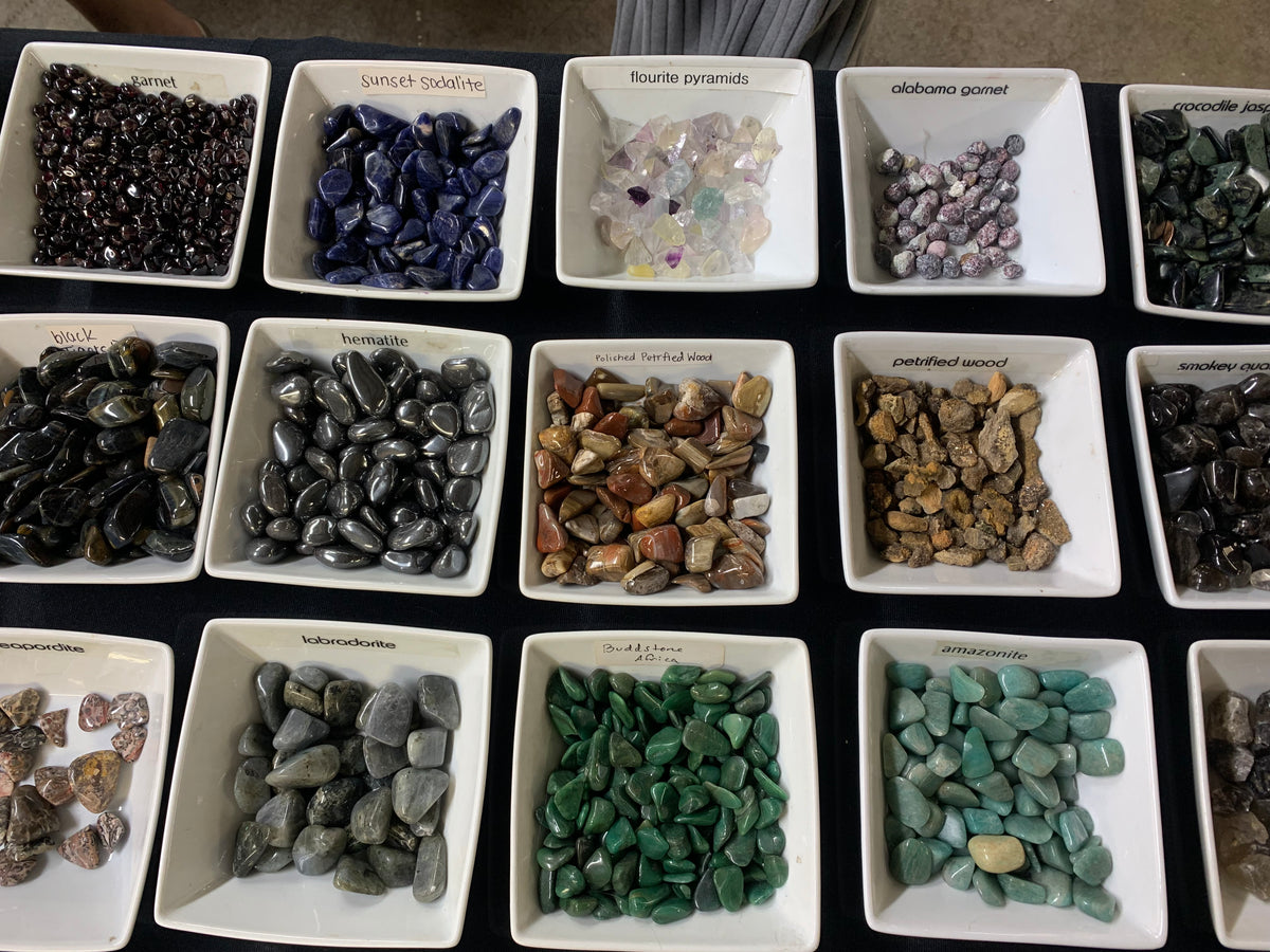 - Colorful assortment of small genuine gemstones, crystals, and mineral specimens at Earthforged Rock Shop.
